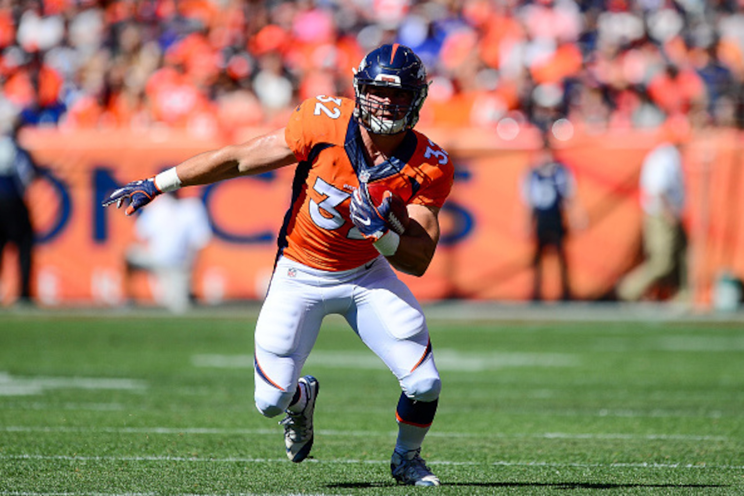 DENVER, CO - SEPTEMBER 18:  Fullback Andy Janovich #32 of the Denver Broncos runs the ball against the Indianapolis Colts at Sports Authority Field at Mile High on September 18, 2016 in Denver, Colorado. (Photo by Dustin Bradford/Getty Images)