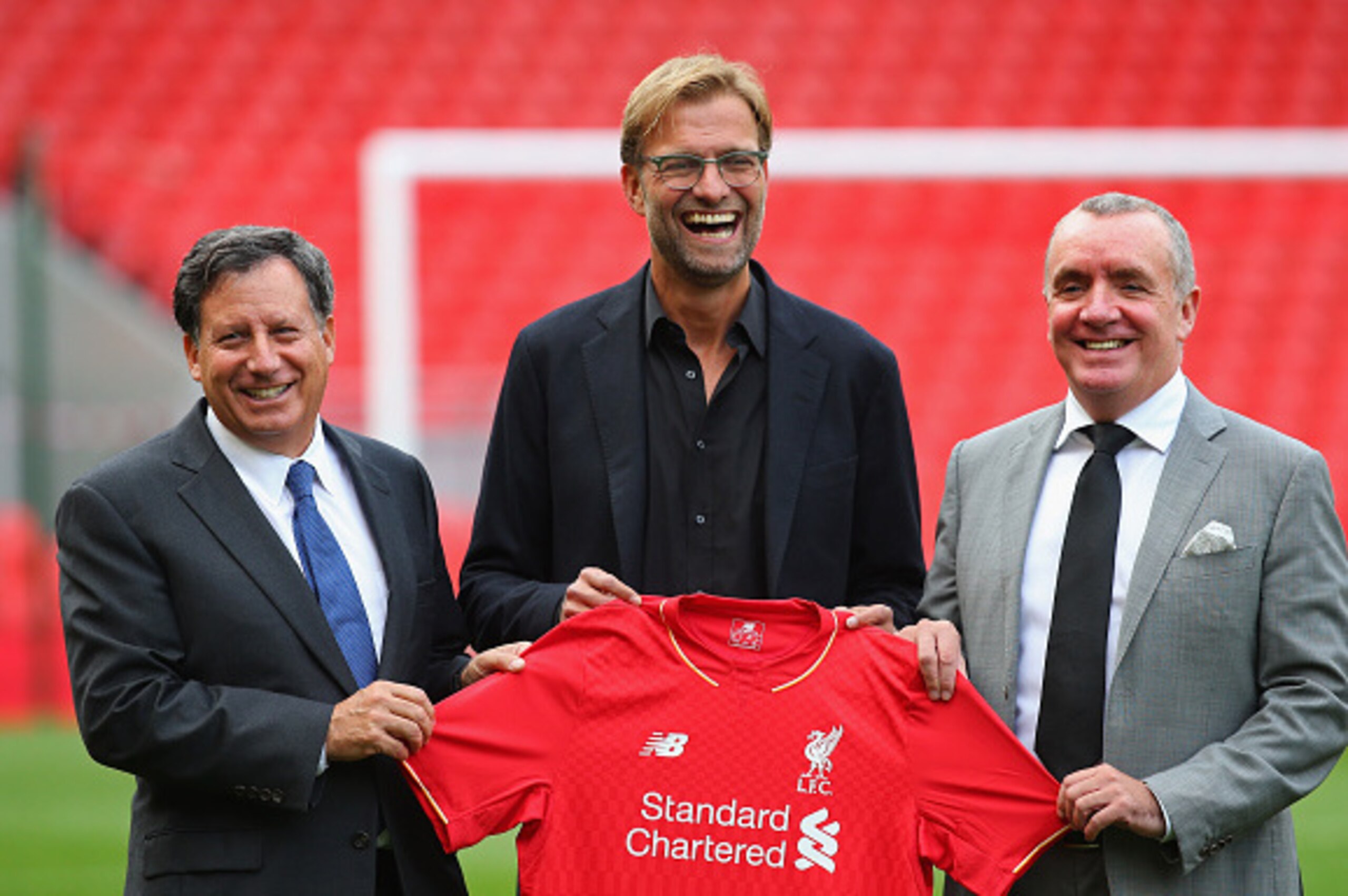 LIVERPOOL, ENGLAND - OCTOBER 09:  Jurgen Klopp at Anfield is unveiled as the new manager of Liverpool FC as he stands alongside Tom Werner (l) the chairman and Ian Ayre (r) the chief executive during a photocall at Anfield on October 9, 2015 in Liverpool,