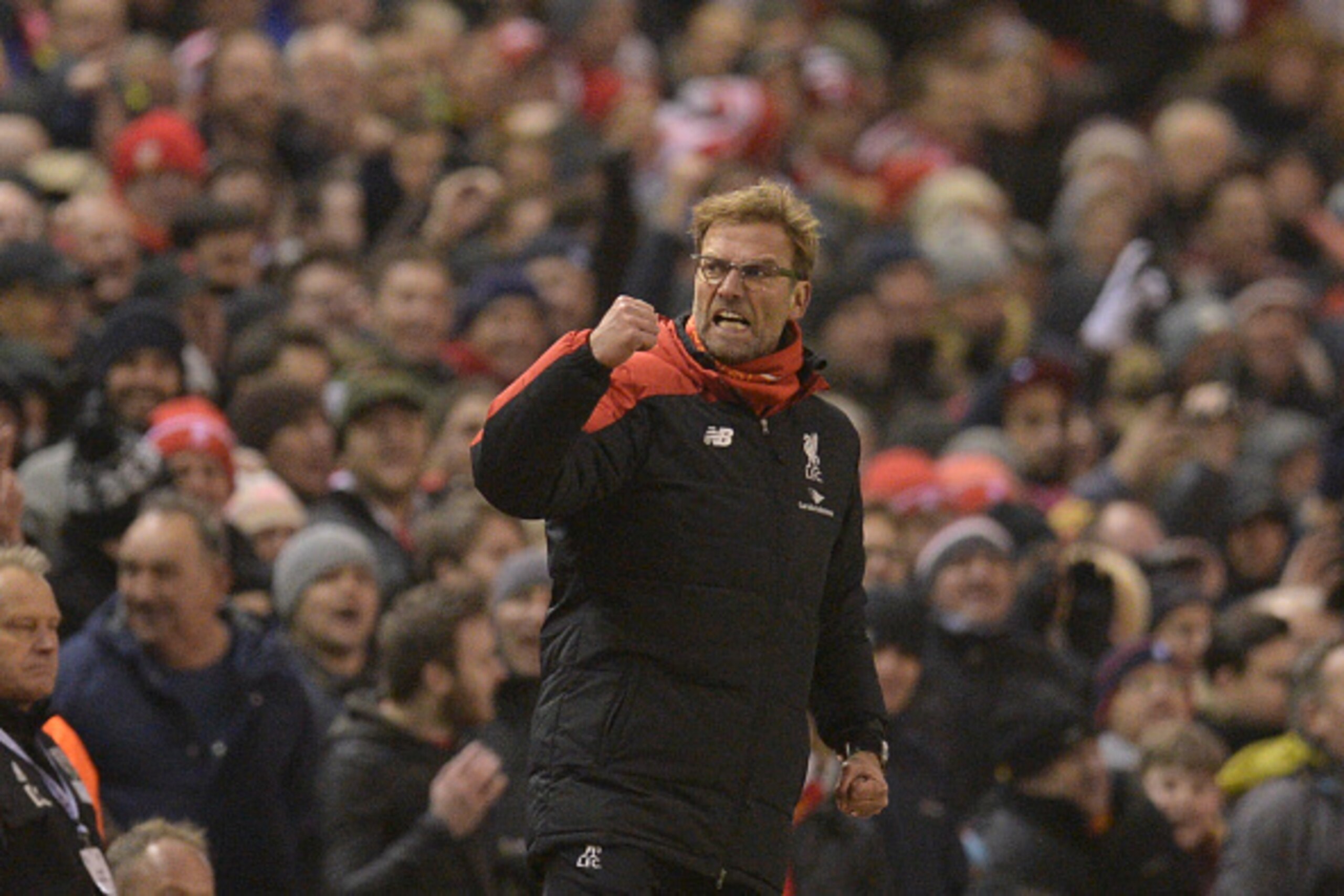 Liverpool's German manager Jurgen Klopp celebrates their late equalising goal to level the score at 2-2 the English Premier League football match between Liverpool and West Bromwich Albion at Anfield in Liverpool, northwest England, on December 13, 2015. 