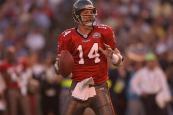 SAN DIEGO - JANUARY 26:  Brad Johnson #14 of the Tampa Bay Buccaneers looks to pass against the Oakland Raiders during Super Bowl XXXVII on January 26, 2003 at Qualcomm Stadium in San Diego, California.  The Buccaneers defeated the Raiders 48-21.  (Photo 