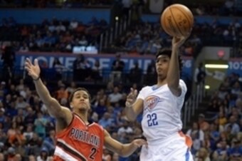 Mar 14, 2016; Oklahoma City, OK, USA; Oklahoma City Thunder guard Cameron Payne (22) passes the ball in front of Portland Trail Blazers guard Brian Roberts (2) during the fourth quarter at Chesapeake Energy Arena. Mandatory Credit: Mark D. Smith-USA TODAY