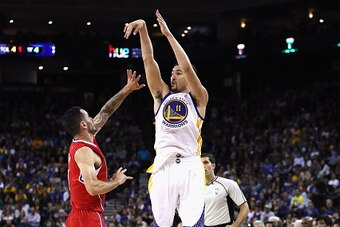 OAKLAND, CA - OCTOBER 04:  Klay Thompson #11 of the Golden State Warriors shoots over JJ Redick #4 of the Los Angeles Clippers during their preseason game at ORACLE Arena on October 4, 2016 in Oakland, California.  NOTE TO USER: User expressly acknowledge