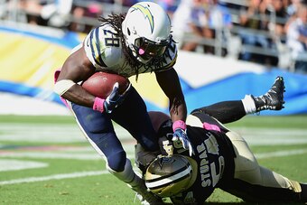 SAN DIEGO, CA - OCTOBER 02:  Melvin Gordon #28 of the San Diego Chargers is pulled down just yards from the end zone by  Nate Stupar #54 of the New Orleans Saints in the second half at Qualcomm Stadium on October 2, 2016 in San Diego, California.  (Photo 