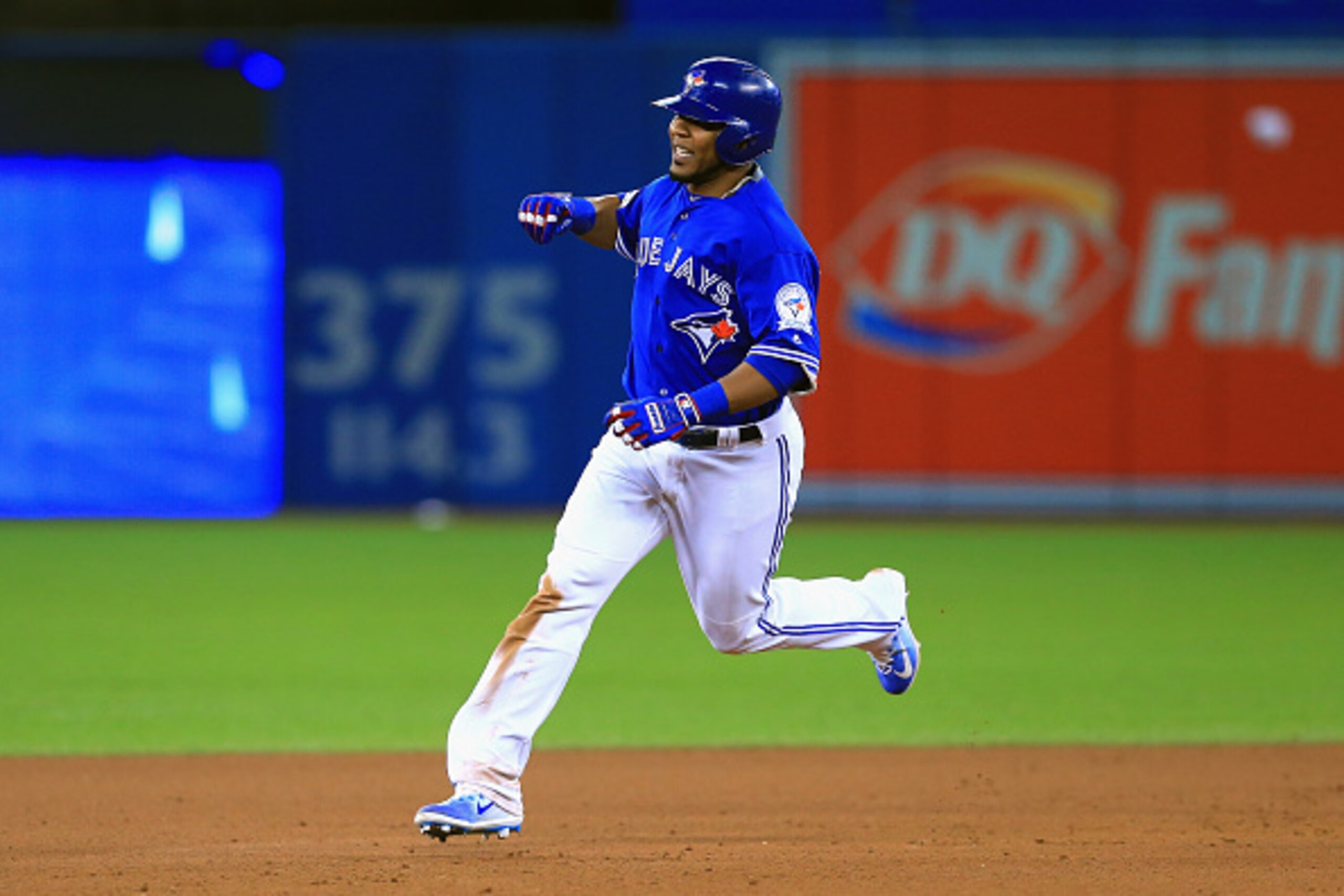 TORONTO, ON - OCTOBER 04:  Edwin Encarnacion #10 of the Toronto Blue Jays runs the bases after hitting a three-run walk-off home run in the eleventh inning to defeat the Baltimore Orioles 5-2 in the American League Wild Card game at Rogers Centre on Octob