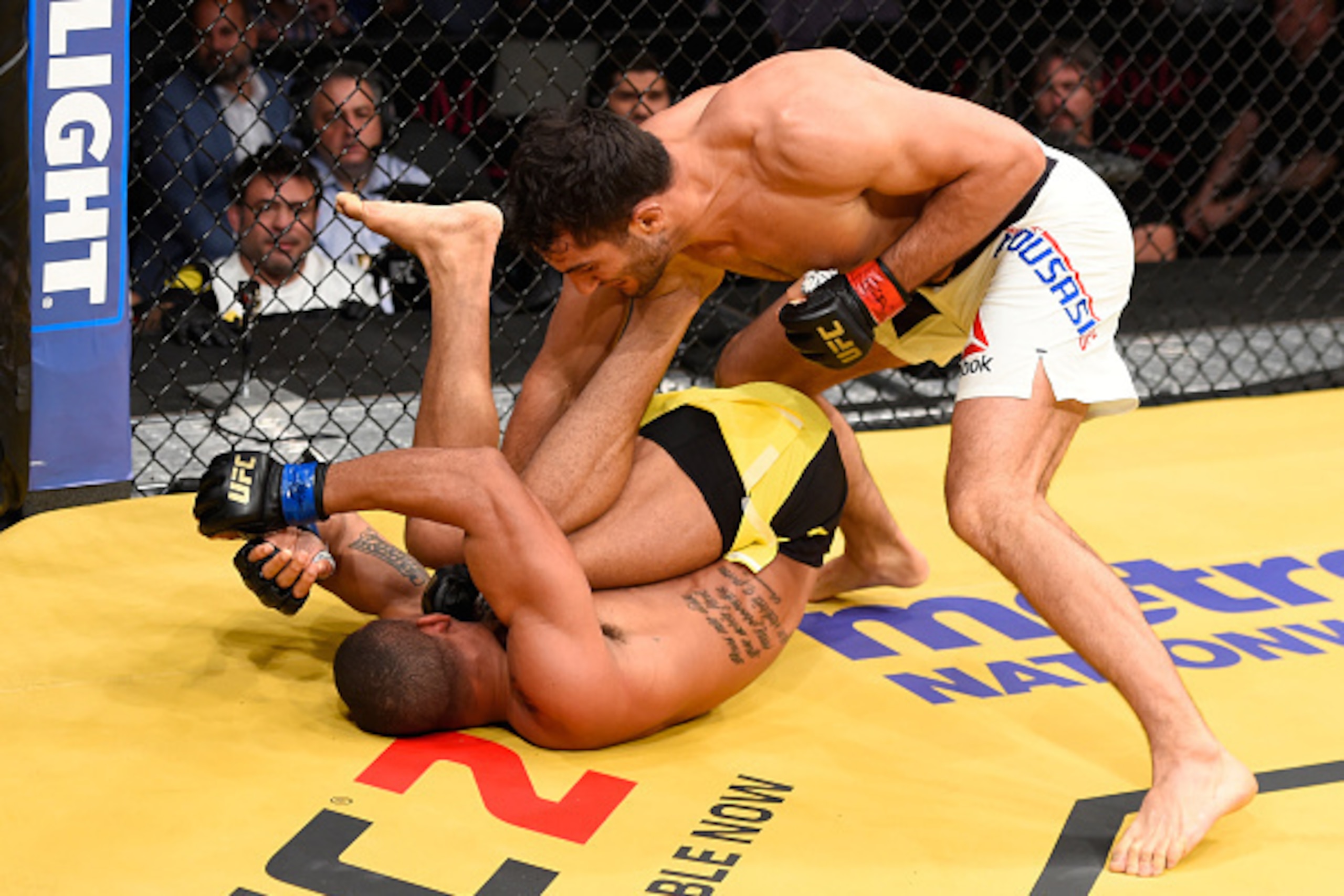 LAS VEGAS, NV - JULY 09: Gegard Mousasi of The Netherlands (top) punches Thiago Santos of Brazil in their middleweight bout during the UFC 200 event on July 9, 2016 at T-Mobile Arena in Las Vegas, Nevada.  (Photo by Josh Hedges/Zuffa LLC/Zuffa LLC via Get