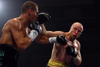 NORWICH, UNITED KINGDOM - FEBRUARY 28:  Jon Thaxton (R) fights Anthony Mezaache in the European Lightweight title at Norfolk Showground on February 28, 2009 in Norwich, England.  (Photo by Julian Finney/Getty Images)