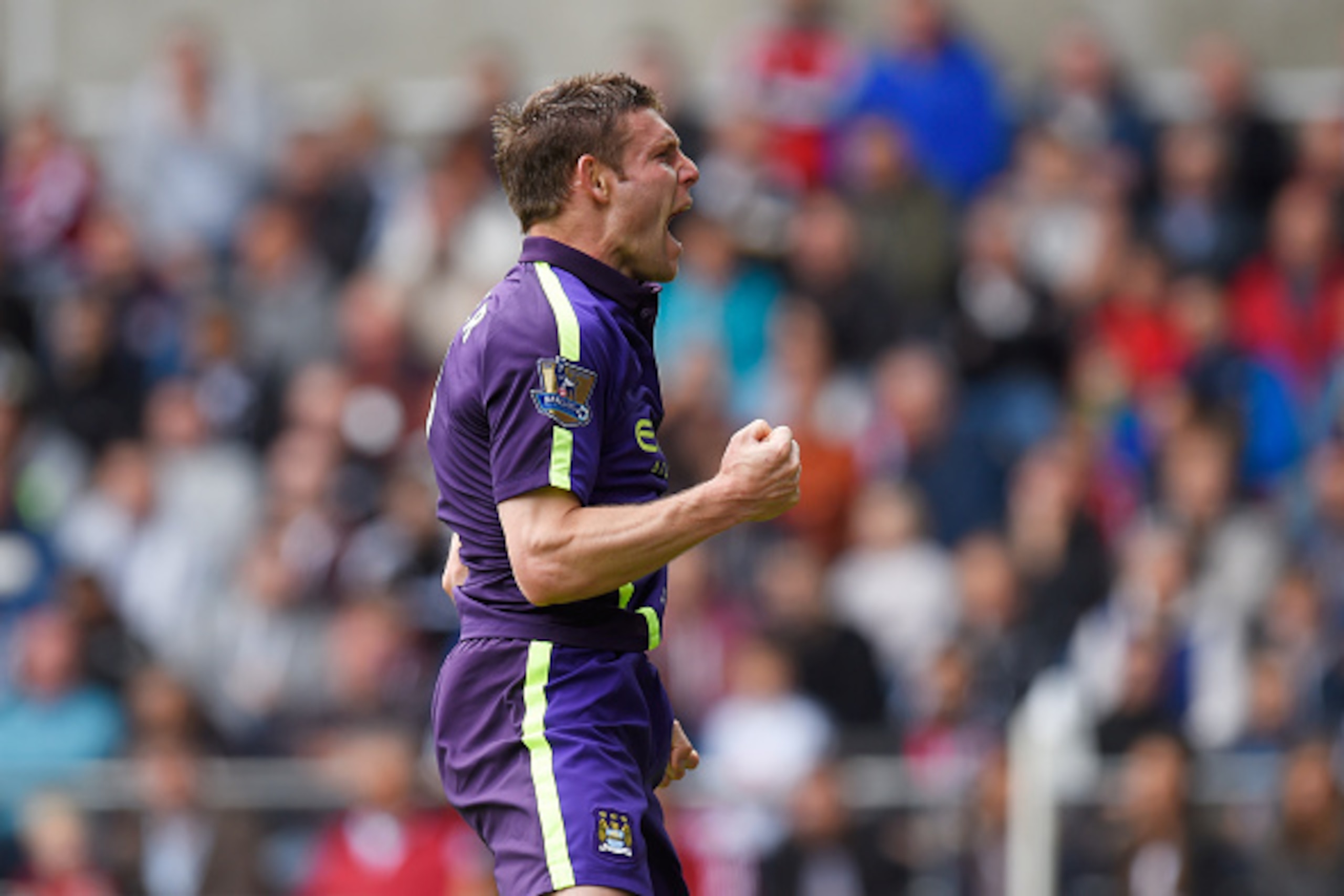 SWANSEA, WALES - MAY 17:  James Milner of Manchester City celebrates after scoring his team's second goal during the Barclays Premier League match between Swansea and Manchester City at the Liberty Stadium on May 17, 2015 in Swansea, Wales.  (Photo by Stu