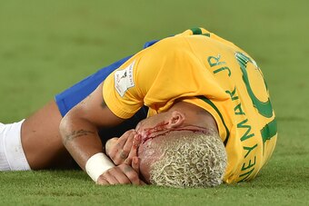 Brazil's Neymar gestures on the ground after receiving an elbow to the face by Bolivia's Yasmani Duk during the Russia 2018 World Cup football qualifier match in Natal, Brazil, on October 6, 2016. / AFP / Nelson ALMEIDA        (Photo credit should read NE