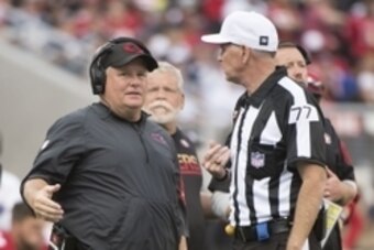 October 2, 2016; Santa Clara, CA, USA; San Francisco 49ers head coach Chip Kelly (left) talks to NFL referee Terry McAulay (77) during the third quarter against the Dallas Cowboys at Levi's Stadium. The Cowboys defeated the 49ers 24-17. Mandatory Credit: 