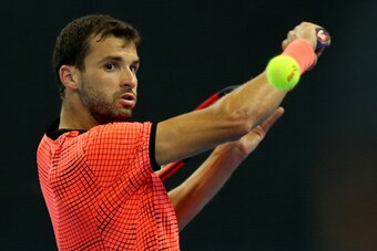 BEIJING, CHINA - OCTOBER 06:  Grigor Dimitrov of  Bulgaria returns a shot against Lucas Pouille of France during the Men's singles 2nd round match  on day six of the 2016 China Open at the China National Tennis Centre on October 6, 2016 in Beijing, China.