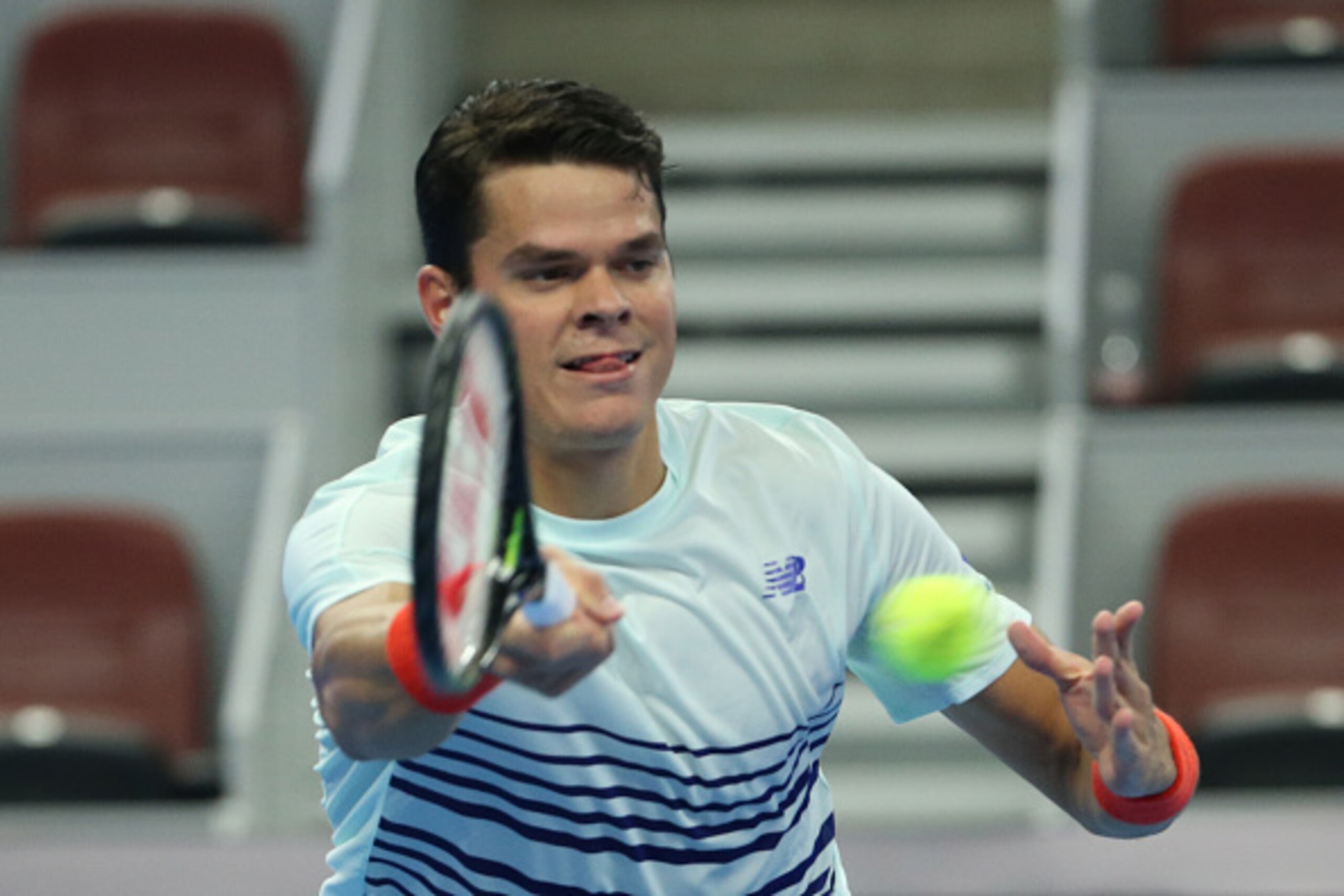 BEIJING, CHINA - OCTOBER 07: Milos Raonic of Canana returns a shot against Malek Jaziri of Tunisia during the Men's singles 2nd round match on day seven of the 2016 China Open at the China National Tennis Centre on October 7, 2016 in Beijing, China. (P BEIJING, CHINA - OCTOBER 07: Milos Raonic of Canana returns a shot against Malek Jaziri of Tunisia during the Men's singles 2nd round match on day seven of the 2016 China Open at the China National Tennis Centre on October 7, 2016 in Beijing, China. (P