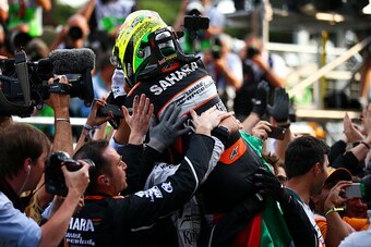 BAKU, AZERBAIJAN - JUNE 19:  Sergio Perez of Mexico and Force India celebrates in parc ferme with his team after finishing third in the European Formula One Grand Prix at Baku City Circuit on June 19, 2016 in Baku, Azerbaijan.  (Photo by Dan Istitene/Gett