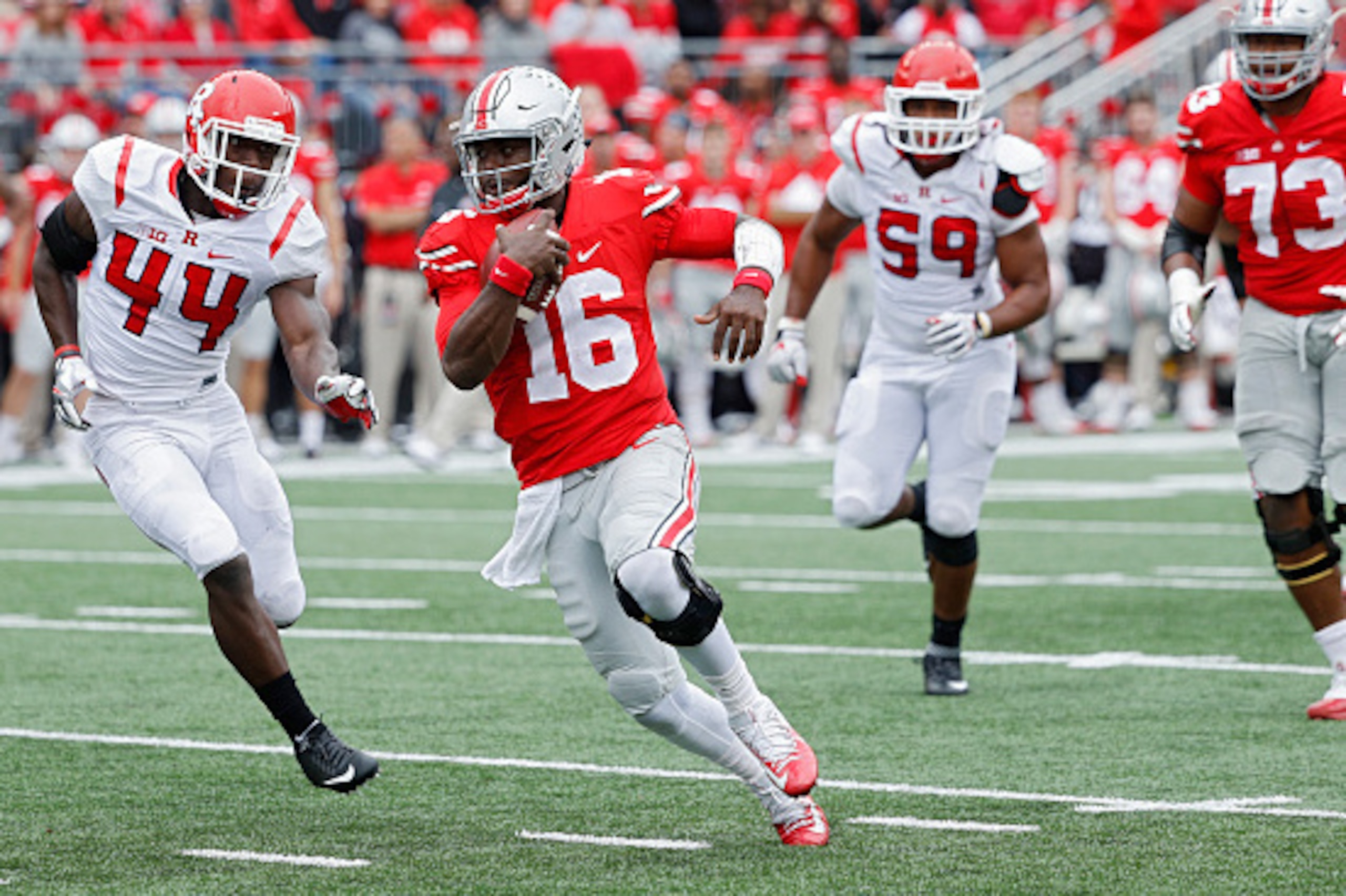 COLUMBUS, OH - OCTOBER 01: J.T. Barrett #16 of the Ohio State Buckeyes runs with the ball during the game against the Rutgers Scarlet Knights at Ohio Stadium on October 1, 2016 in Columbus, Ohio. The Buckeyes defeated the Scarlet Knights 58-0. (Photo by J