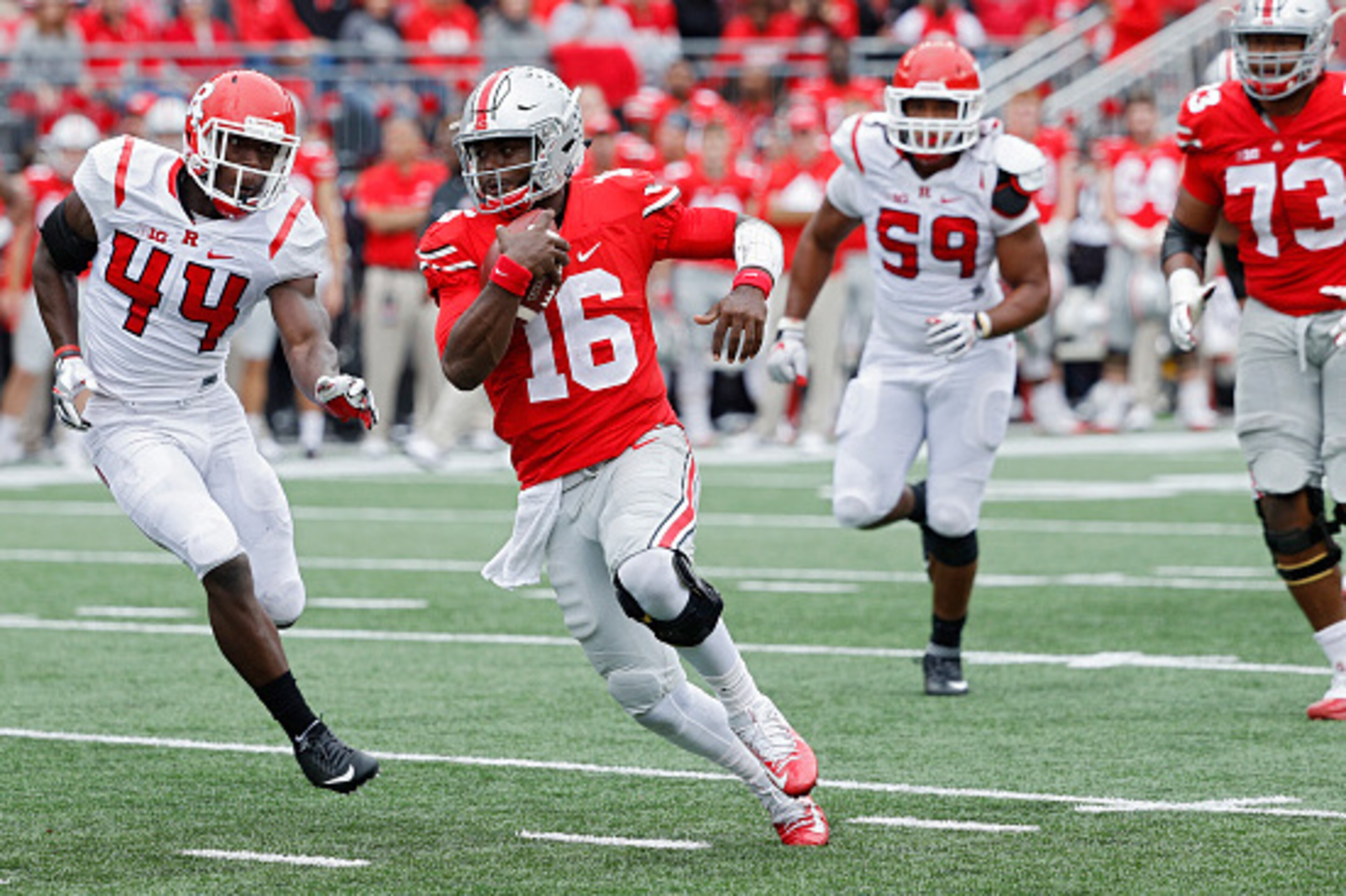 COLUMBUS, OH - OCTOBER 01: J.T. Barrett #16 of the Ohio State Buckeyes runs with the ball during the game against the Rutgers Scarlet Knights at Ohio Stadium on October 1, 2016 in Columbus, Ohio. The Buckeyes defeated the Scarlet Knights 58-0. (Photo by J