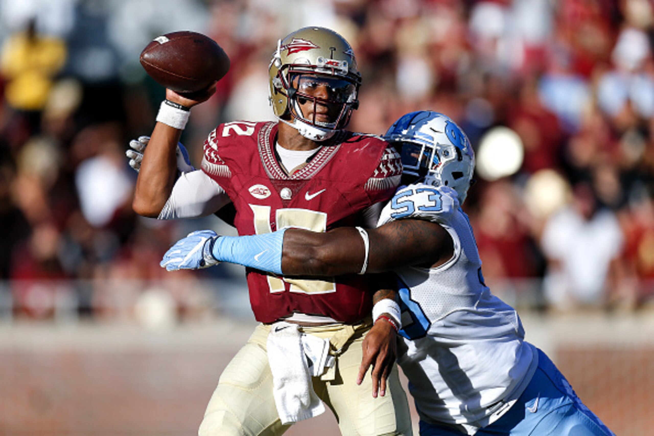 TALLAHASSEE, FL - OCTOBER 1: Quarterback Deondre Francios #12 of the Florida State Seminoles is sacked by Defensive End Malik Carney #53 of the North Carolina Tar Heels during the game at Doak Campbell Stadium on Bobby Bowden Field on October 1, 2016 in T