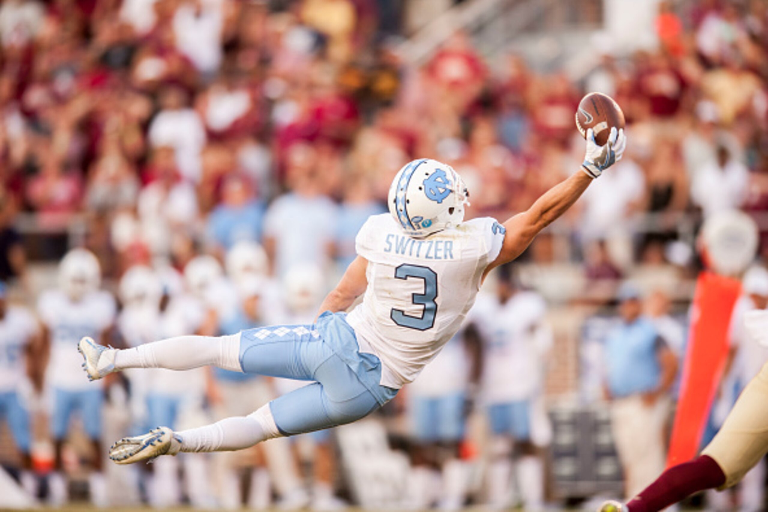 TALLAHASSEE, FL - OCTOBER 01: Ryan Switzer #3 of the North Carolina Tar Heels stretches out in an attempt to make a catch against the Florida State Seminoles at Doak Campbell Stadium on October 1, 2016 in Tallahassee, Florida. (Photo by Jeff Gammons/Getty