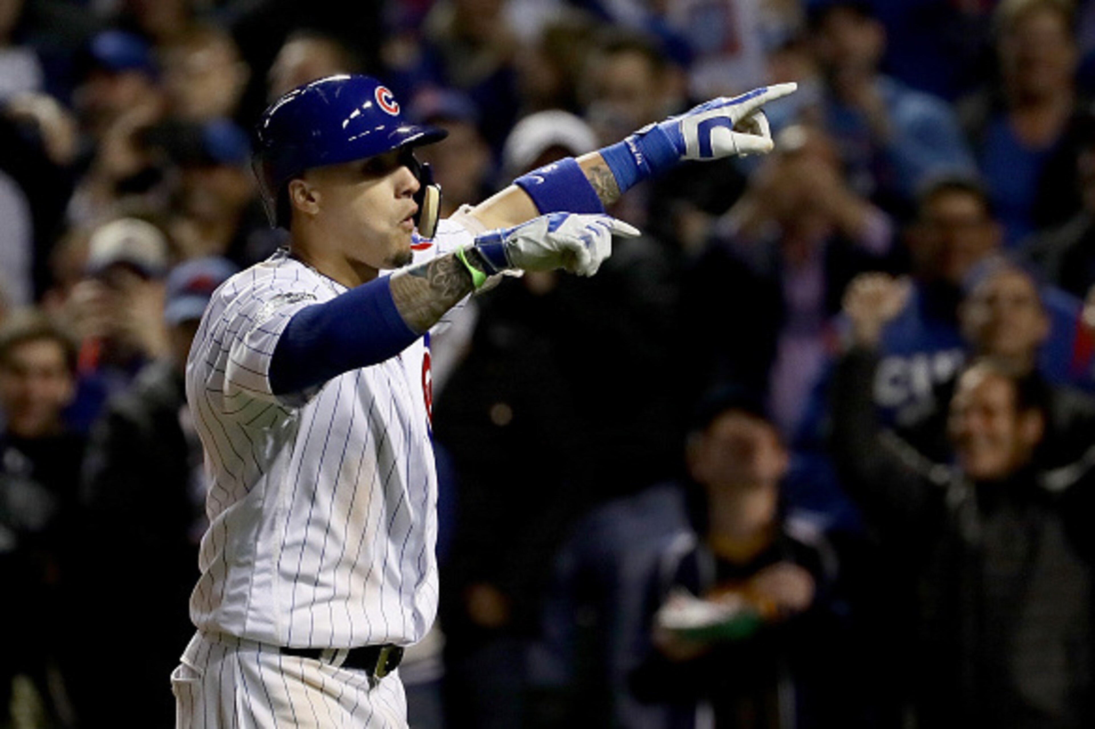 CHICAGO, ILLINOIS - OCTOBER 07:  Javier Baez #9 of the Chicago Cubs celebrates after hitting a home run in the eighth inning against the San Francisco Giants at Wrigley Field on October 7, 2016 in Chicago, Illinois.  (Photo by Jonathan Daniel/Getty Images
