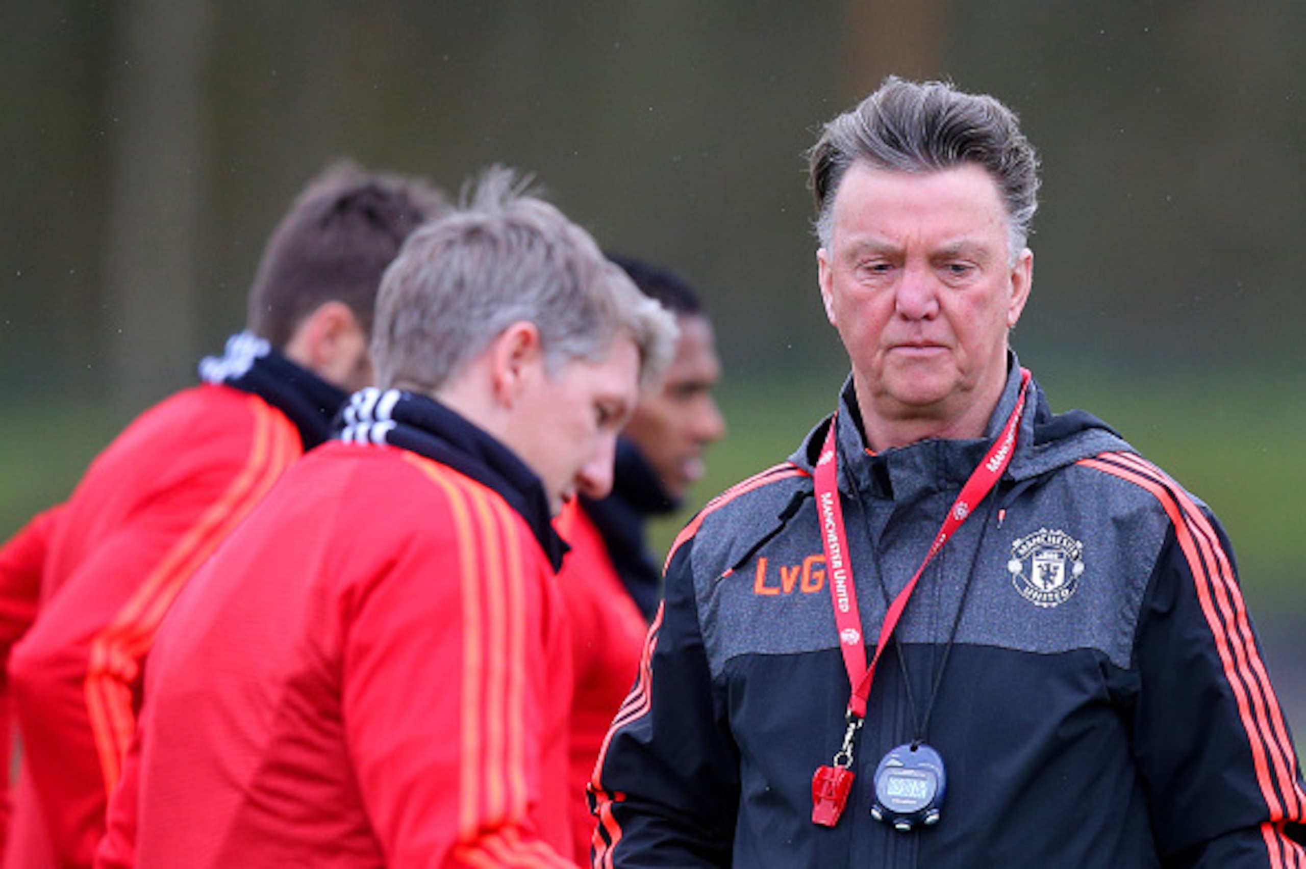MANCHESTER, ENGLAND - MARCH 09:  Louis van Gaal, manager of Manchester Uniited looks on next to Bastian Schweinsteiger of Manchester United during a training session ahead of the UEFA Europa League round of 16 first leg match between Liverpool and Manches