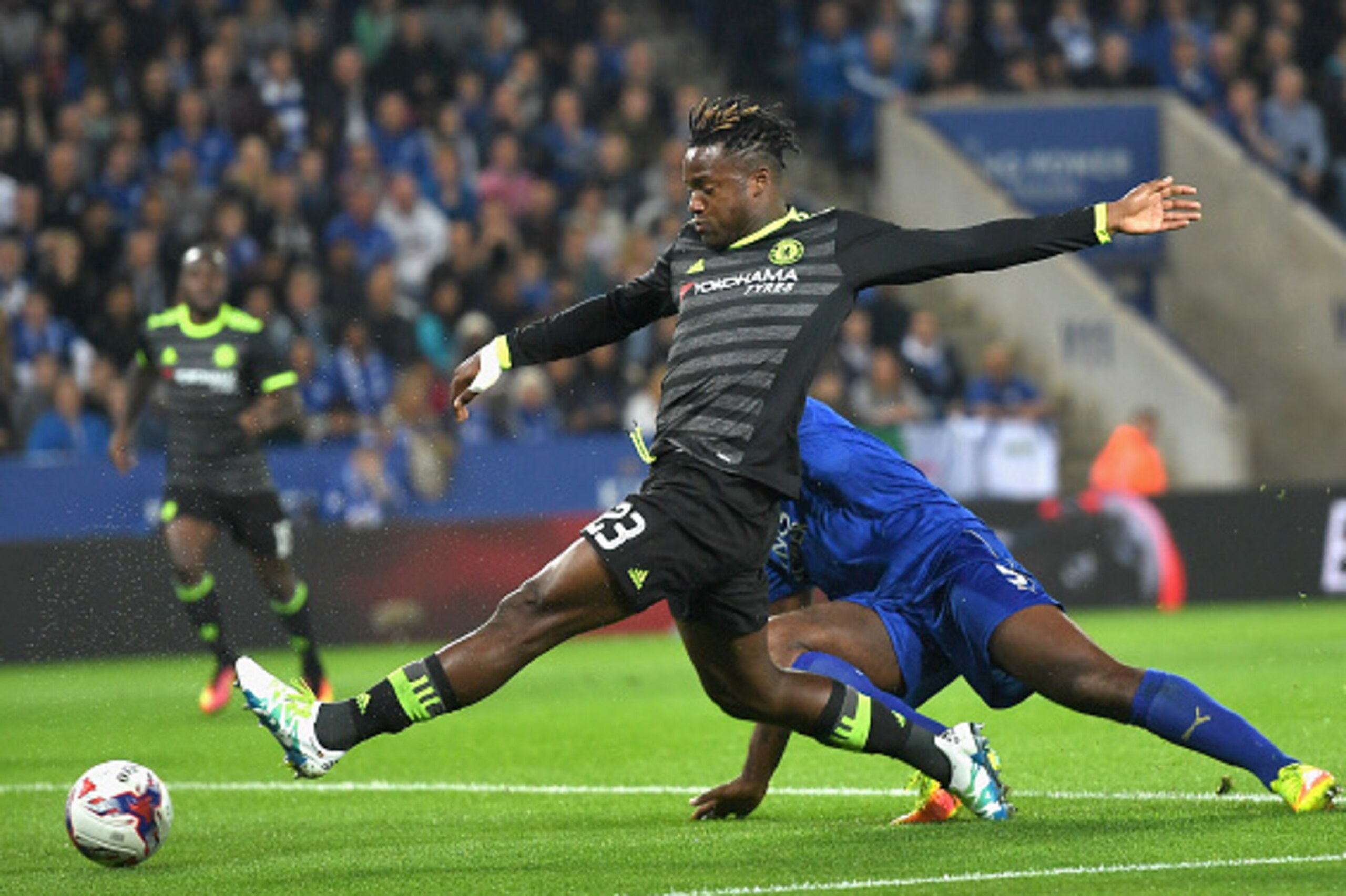 LEICESTER, ENGLAND - SEPTEMBER 20:  Michy Batshuayi of Chelsea takes the ball past Wes Morgan of Leicester City during the EFL Cup Third Round match between Leicester City and Chelsea at The King Power Stadium on September 20, 2016 in Leicester, England. 