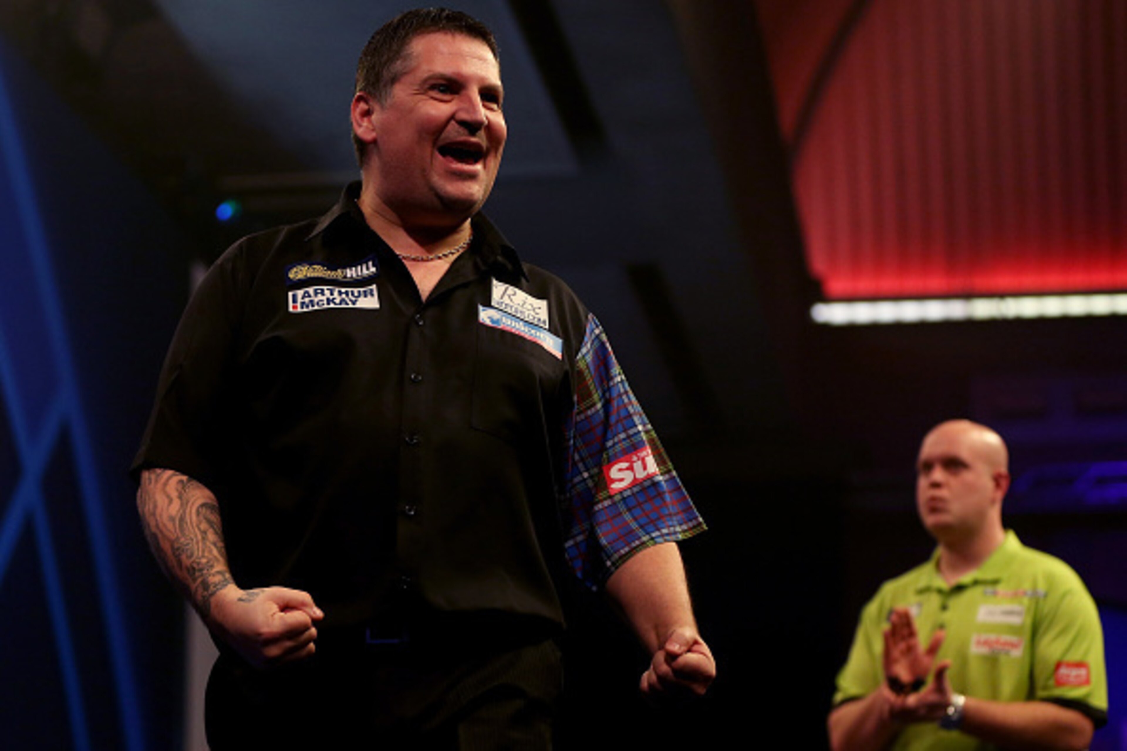 LONDON, ENGLAND - JANUARY 03:  Gary Anderson of Scotland celebrates winning his semi final match against Michael van Gerwen of the Netherlands on day thirteen of the 2015 William Hill PDC World Darts Championships at Alexandra Palace on January 3, 2015 in