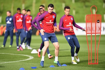 BURTON-UPON-TRENT, ENGLAND - OCTOBER 07:  Michael Keane of England (L) and Dele Alli of England (R) warm up during an England training session ahead of the FIFA 2018 World Cup Group F Qualifier match against Malta at St Georges Park on October 7, 2016 in 