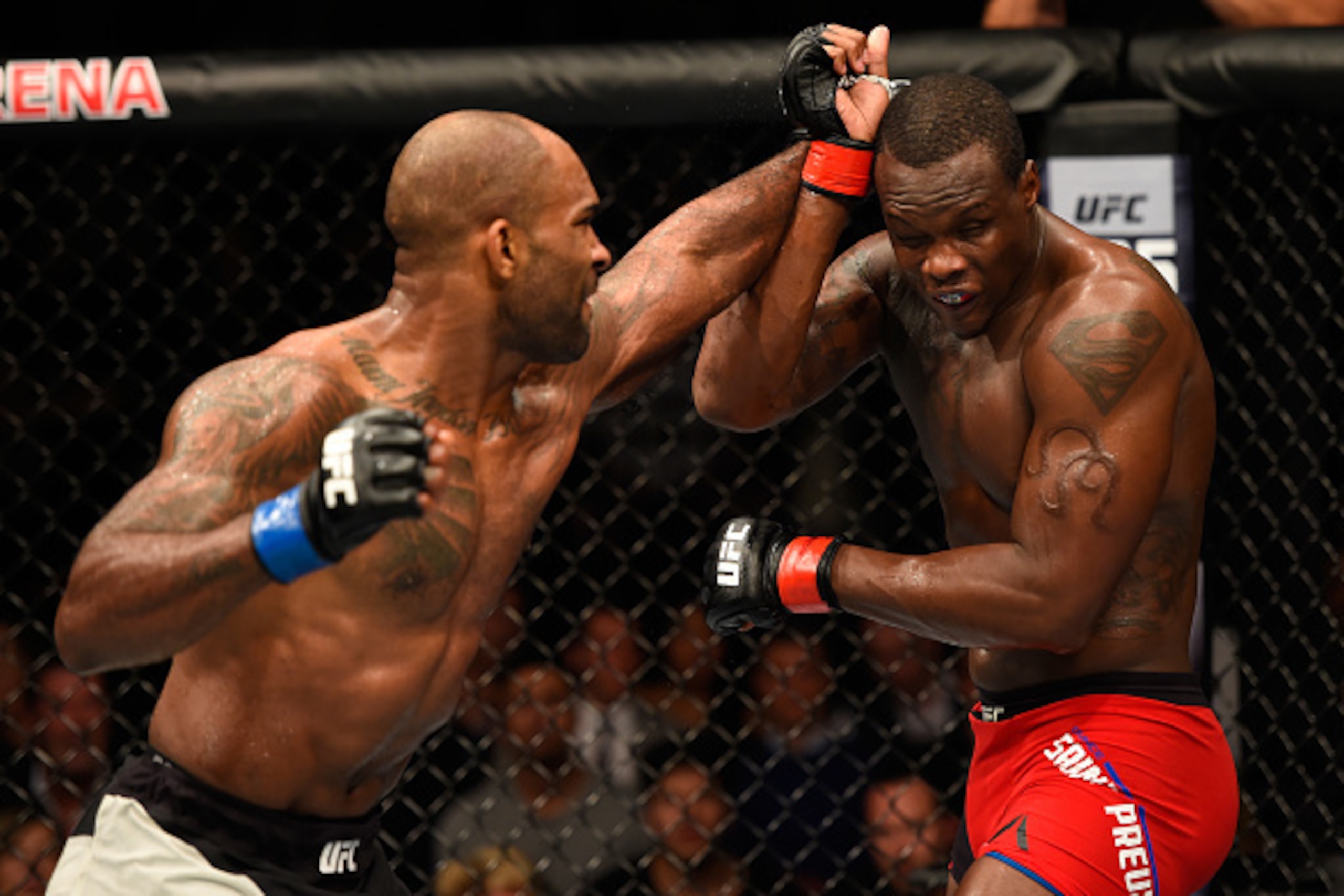 MANCHESTER, ENGLAND - OCTOBER 08:  (L-R) Jimi Manuwa of England punches Ovince Saint Preux in their light heavyweight bout during the UFC 204 Fight Night at the Manchester Evening News Arena on October 8, 2016 in Manchester, England. (Photo by Josh Hedges