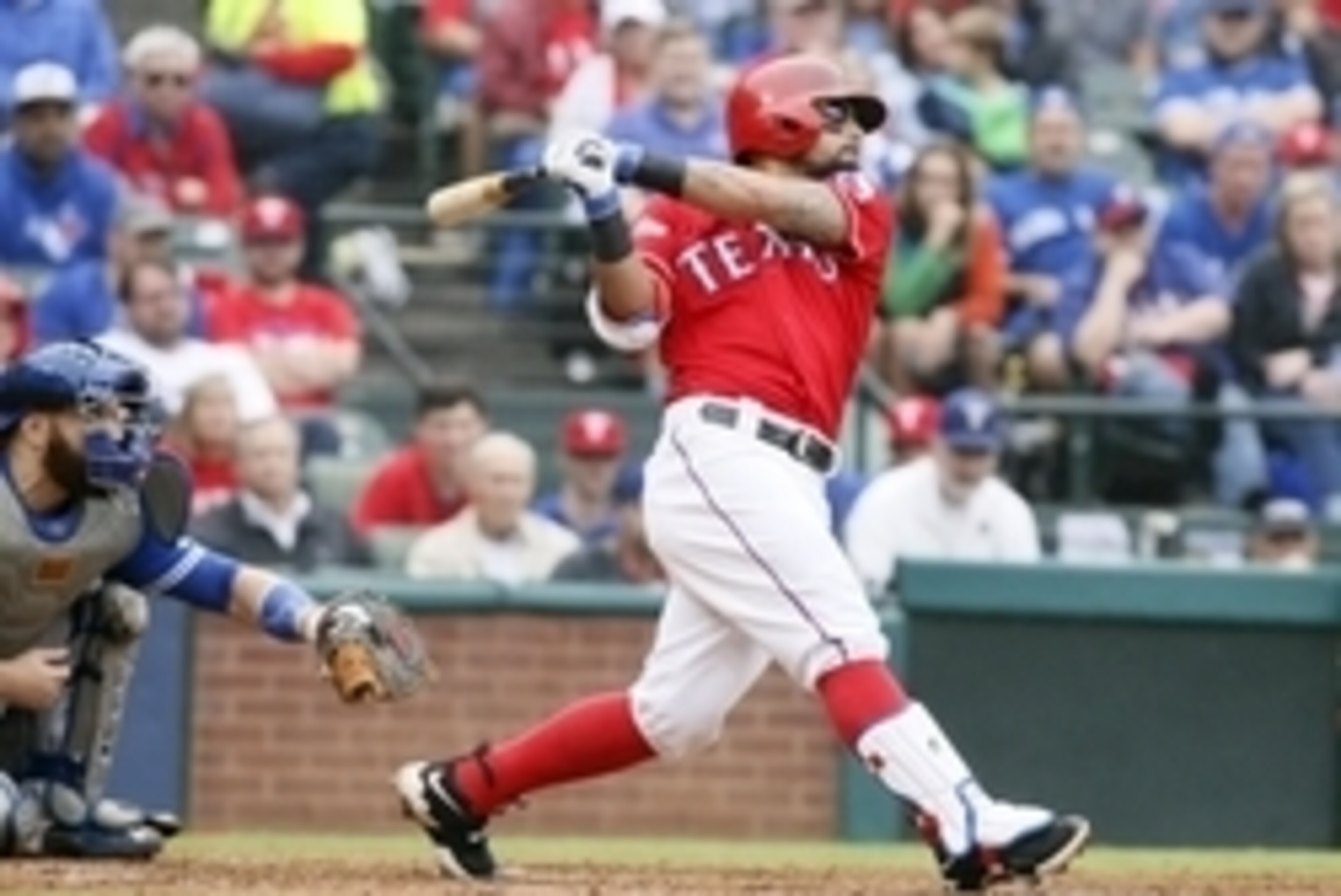 Oct 7, 2016; Arlington, TX, USA; Texas Rangers second baseman Rougned Odor (12) singles against the Toronto Blue Jays during the third inning of game two of the 2016 ALDS playoff baseball series at Globe Life Park in Arlington. Mandatory Credit: Tim Heitm