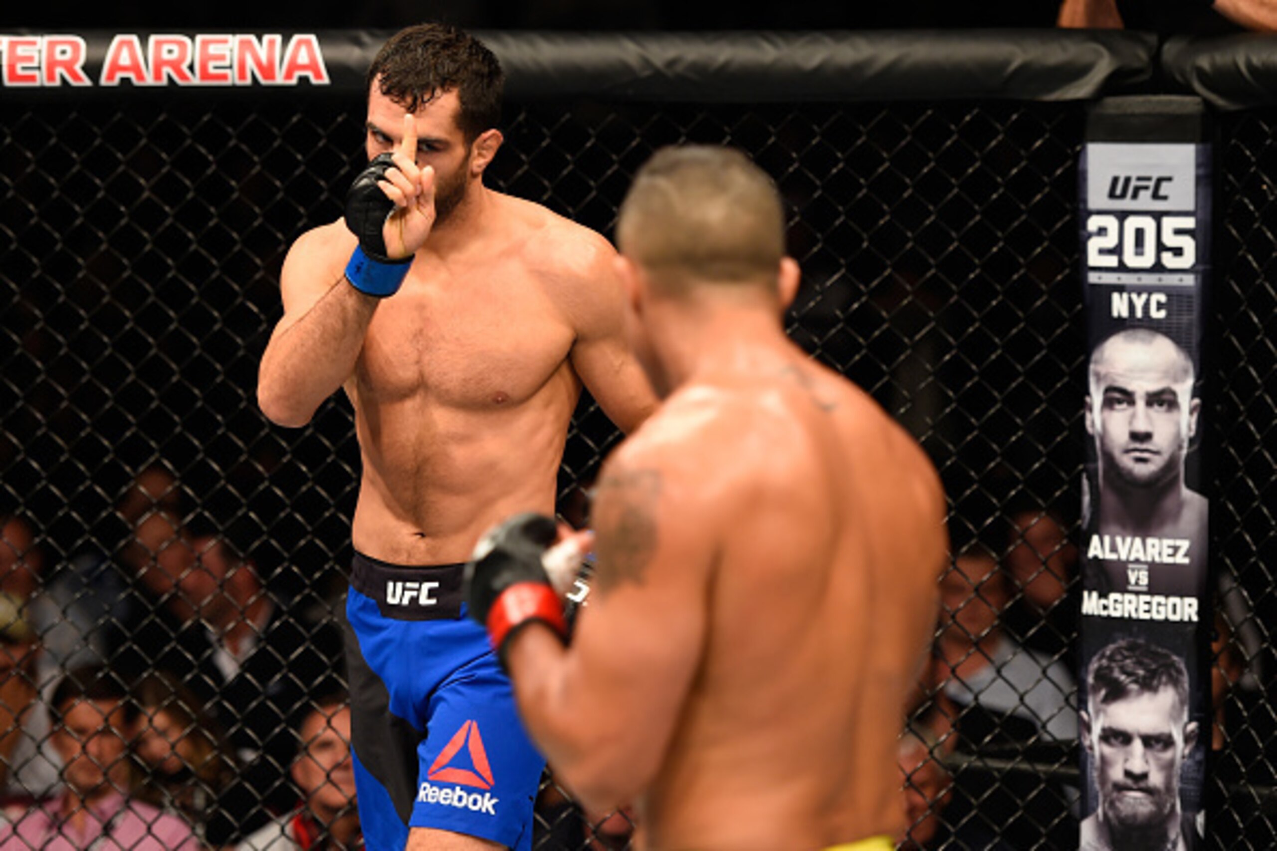 MANCHESTER, ENGLAND - OCTOBER 08:  (L-R) Gegard Mousasi of The Netherlands taunts Vitor Belfort of Brazil in their middleweight bout during the UFC 204 Fight Night at the Manchester Evening News Arena on October 8, 2016 in Manchester, England. (Photo by J