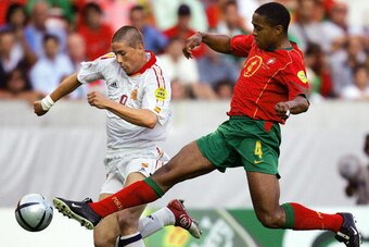 LISBON, Portugal:  Spain's striker Fernando Torres (L) vies with Portugal's defender Jorge Andrade,20 June 2004 at Jose Alvalade stadium in Lisbon, during their Euro 2004 group A football match at the European Nations championship in Portugal. AFP PHOTO J
