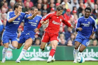 LIVERPOOL, UNITED KINGDOM - AUGUST 19:  Fernando Torres of Liverpool is pressurised by John Terry (L) , Frank Lampard and John Obi Mikel (R) of Chelsea during the Barclays Premier League match between Liverpool and Chelsea at Anfield on August 19, 2007 in