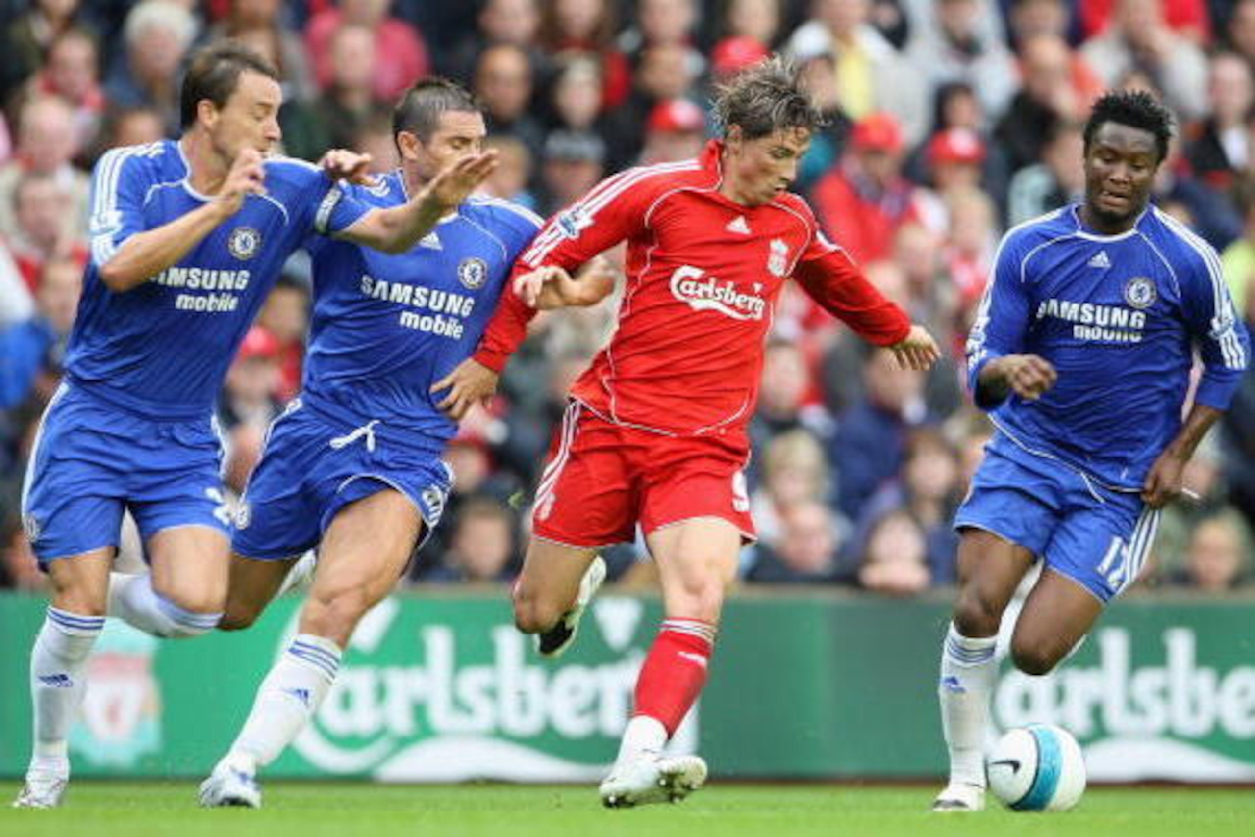 LIVERPOOL, UNITED KINGDOM - AUGUST 19:  Fernando Torres of Liverpool is pressurised by John Terry (L) , Frank Lampard and John Obi Mikel (R) of Chelsea during the Barclays Premier League match between Liverpool and Chelsea at Anfield on August 19, 2007 in