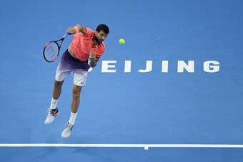 Grigor Dimitrov of Bulgaria serves against Andy Murray of Britain during the men's singles final at the China Open tennis tournament in Beijing on October 9, 2016. / AFP / WANG ZHAO        (Photo credit should read WANG ZHAO/AFP/Getty Images)