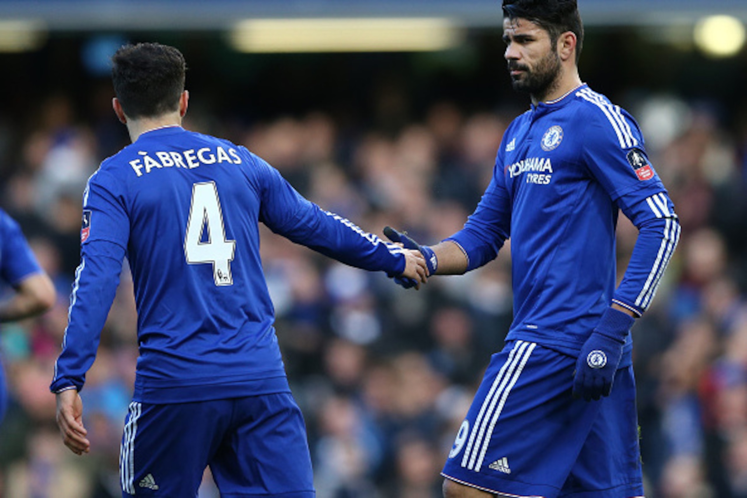 Chelsea's Brazilian-born Spanish striker Diego Costa (R) celebrates with Chelsea's Spanish midfielder Cesc Fabregas after scoring his team's first goal during the FA Cup third-round football match between Chelsea and Scunthorpe United at Stamford Bridge i