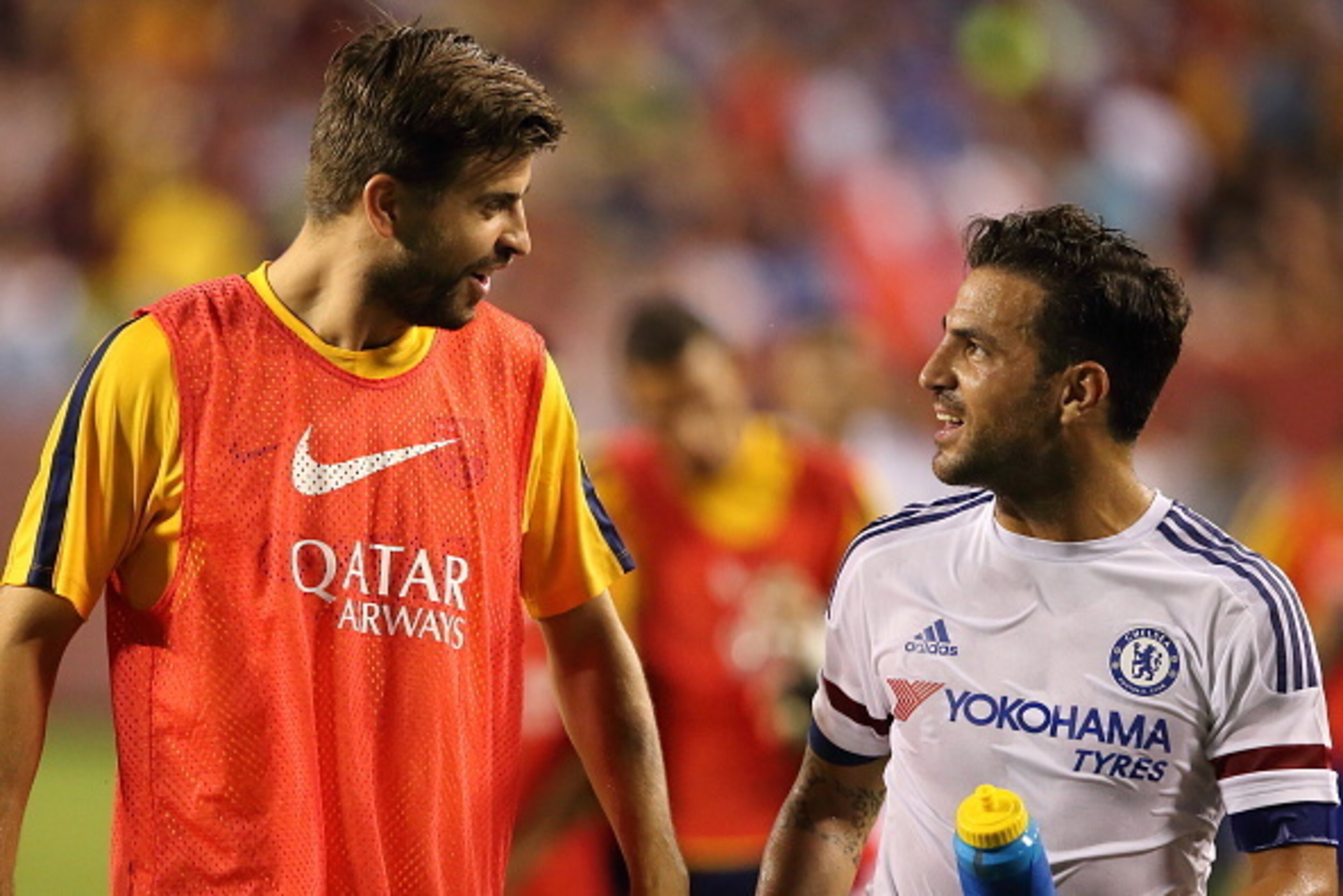 LANDOVER, MD - JULY 28:  Gerard Pique of FC Barcelona chats to Cesc Fabregas of Chelsea during the International Champions Cup match between Barcelona and Chelsea at FedExField on July 28, 2015 in Landover, Maryland.  (Photo by Matthew Ashton - AMA/Getty 