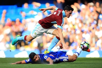 LONDON, ENGLAND - AUGUST 27:  Diego Costa of Chelsea is fouled by Michael Keane of Burnley during the Premier League match between Chelsea and Burnley at Stamford Bridge on August 27, 2016 in London, England.  (Photo by Ben Hoskins/Getty Images)