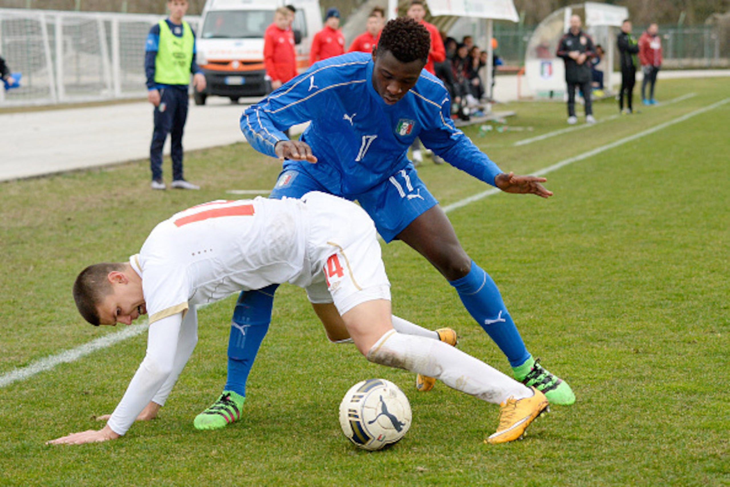 MANZANO, ITALY - FEBRUARY 16:  Bioty Moise Kean (R) of Italy U17 competes with Ranko Veselenovic of Serbia U17during the international friendly match between Italy U17 and Serbia U17 at Stadio Comunale  on February 16, 2016 in Manzano, Italy.  (Photo by D
