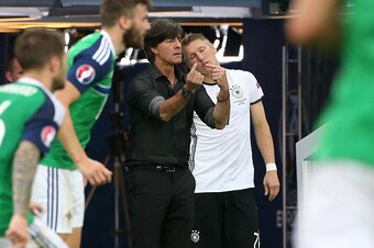 PARIS, FRANCE - JUNE 21: Coach of Germany Joachim Loew gestures while Bastian Schweinsteiger of Germany gets ready to enter the pitch during the UEFA EURO 2016 Group C match between Northern Ireland and Germany at Parc des Princes on June 21, 2016 in Pari