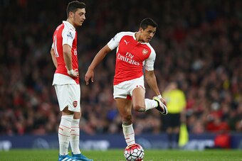 LONDON, ENGLAND - APRIL 21:  Mesut Ozil and Alexis Sanchez of Arsenal prepare to kick off during the Barclays Premier League match between Arsenal and West Bromwich Albion at the Emirates Stadium on April 21, 2016 in London, England.  (Photo by Paul Gilha