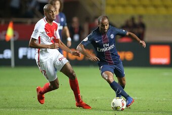 MONACO, MONACO - AUGUST 28: Lucas Moura of PSG and Fabio Tavares aka Fabinho of Monaco (left) in action during the French Ligue 1 match between AS Monaco (ASM) and Paris Saint-Germain (PSG) at Stade Louis II on August 28, 2016 in Monaco, Monaco. (Photo by