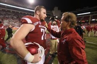 Oct 8, 2016; Fayetteville, AR, USA; Alabama Crimson Tide head coach Nick Saban offers his condolences to Arkansas Razorbacks center Frank Ragnow (72) for the loss Ragnow's father after the game at Donald W. Reynolds Razorback Stadium. Alabama defeated Ark
