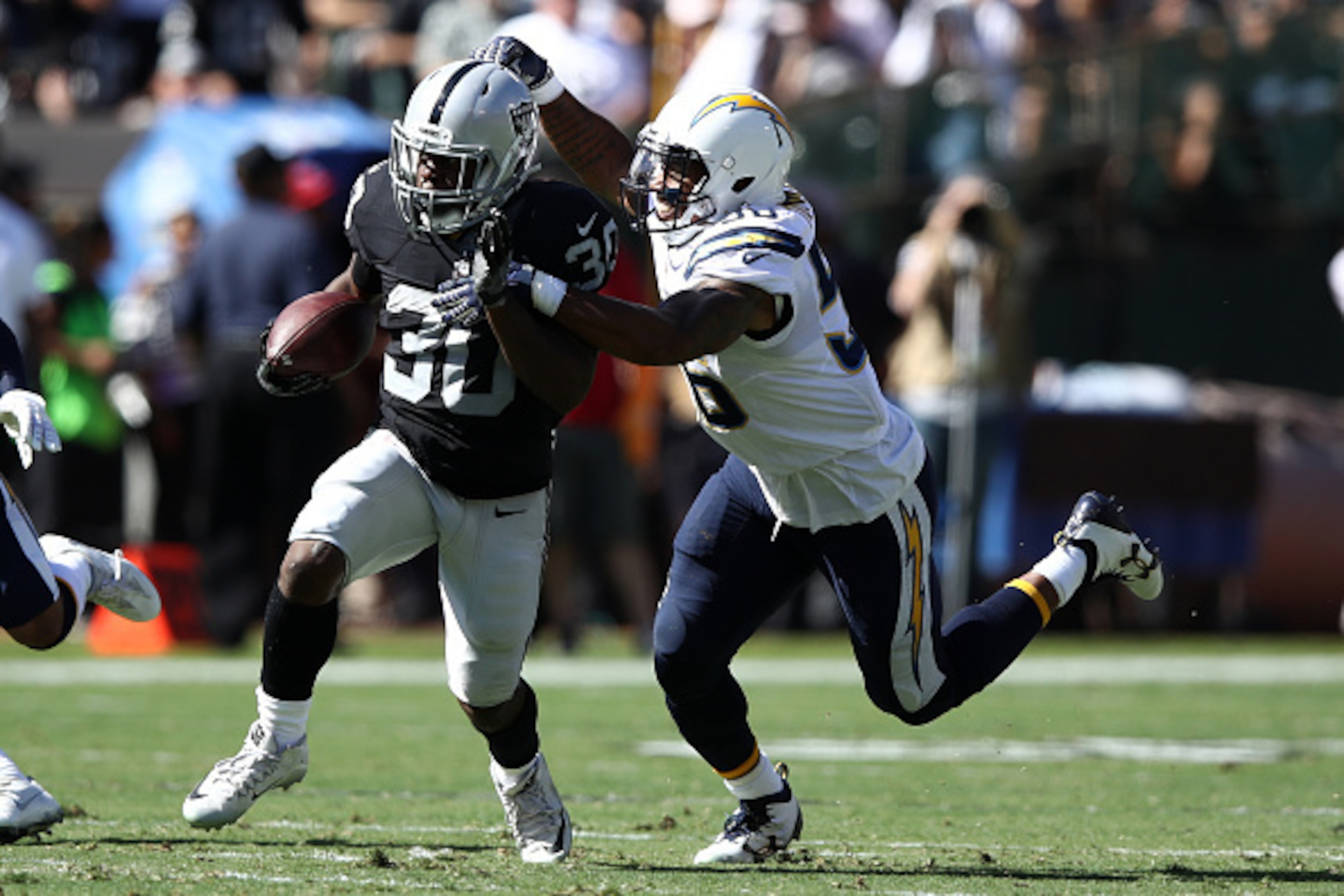 OAKLAND, CA - OCTOBER 09:  Jalen Richard #30 of the Oakland Raiders rushes with the ball against the San Diego Chargers during their NFL game at Oakland-Alameda County Coliseum on October 9, 2016 in Oakland, California.  (Photo by Ezra Shaw/Getty Images)