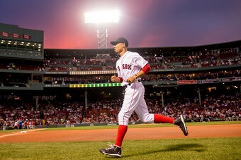 BOSTON, MA - SEPTEMBER 14: Mookie Betts #50 of the Boston Red Sox warms up before a game against the Baltimore Orioles on September 14, 2016 at Fenway Park in Boston, Massachusetts. (Photo by Billie Weiss/Boston Red Sox/Getty Images)
