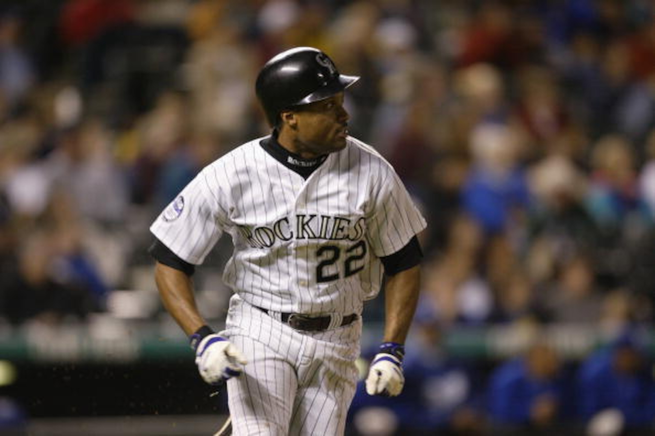 DENVER - SEPTEMBER 12:  Terry Shumpert #22 of the Colorado Rockies watches the ball after getting a hit during the game against the Los Angeles Dodgers on September 12, 2002 at Coors Field in Denver, Colorado.  The Rockies defeated the Dodgers 7-1.  (Phot