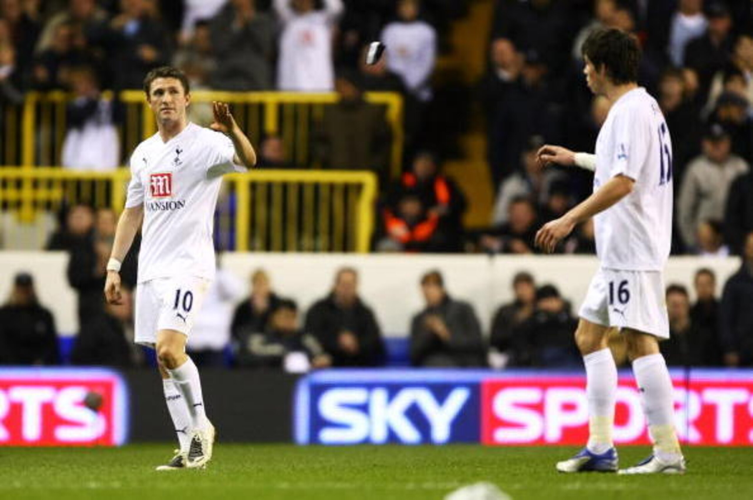 LONDON - DECEMBER 02: Robbie Keane tosses the captain's armband to Gareth Bale of Tottenham during the Barclays Premier League match between Tottenham Hotspur and Birmingham City at White Hart Lane on December 2, 2007 in London, England.  (Photo by Mike H