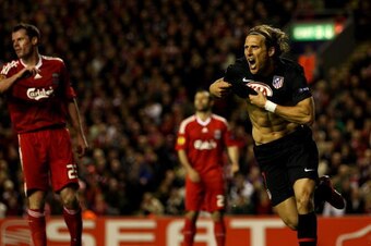 LIVERPOOL, ENGLAND - APRIL 29:  Diego Forlan of Atletico Madrid celebrates scoring his team's first goal in extra time during the UEFA Europa League Semi-Final Second Leg match between Liverpool and Atletico Madrid at Anfield on April 29, 2010 in Liverpoo