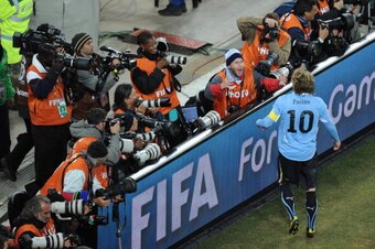 Uruguay's striker Diego Forlan celebrates after the 2010 World Cup quarter final Uruguay vs Ghana on July 2, 2010 at Soccer City stadium in Soweto, suburb of Johannesburg. Uruguay won 4-2 on penalty shots. NO PUSH TO MOBILE / MOBILE USE SOLELY WITHIN EDIT