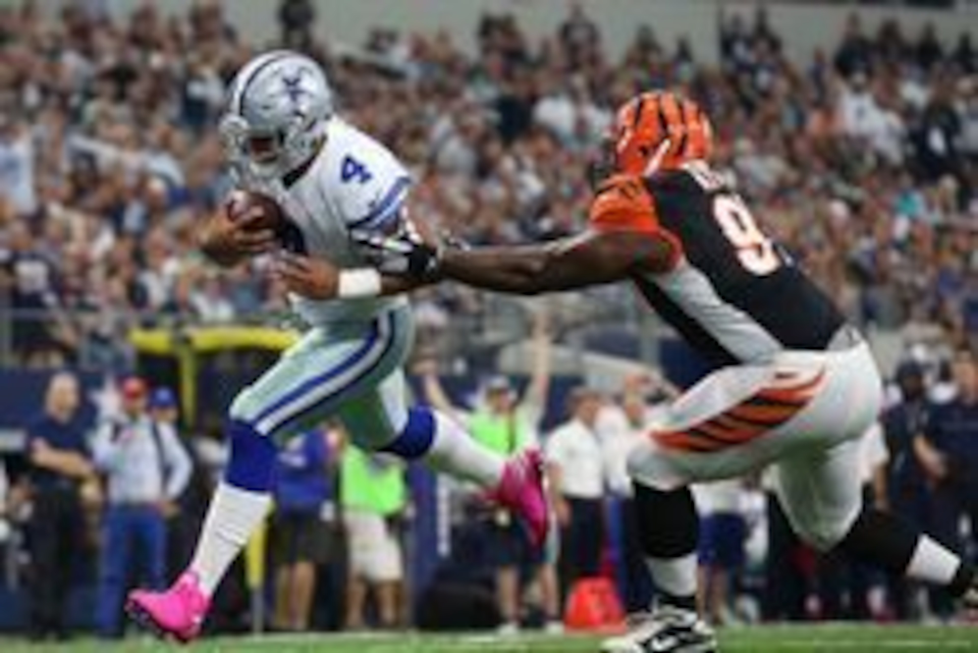Oct 9, 2016; Arlington, TX, USA; Dallas Cowboys quarterback Dak Prescott (4) runs for a touchdown in the second quarter against Cincinnati Bengals defensive tackle Geno Atkins (96) at AT&T Stadium. Mandatory Credit: Matthew Emmons-USA TODAY Sports Oct 9, 2016; Arlington, TX, USA; Dallas Cowboys quarterback Dak Prescott (4) runs for a touchdown in the second quarter against Cincinnati Bengals defensive tackle Geno Atkins (96) at AT&T Stadium. Mandatory Credit: Matthew Emmons-USA TODAY Sports