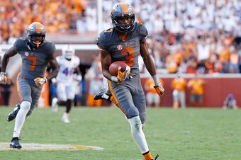KNOXVILLE, TN - SEPTEMBER 24: Josh Malone #3 of the Tennessee Volunteers runs down the field with a touchdown reception against the Florida Gators during the game at Neyland Stadium on September 24, 2016 in Knoxville, Tennessee. Tennessee defeated Florida