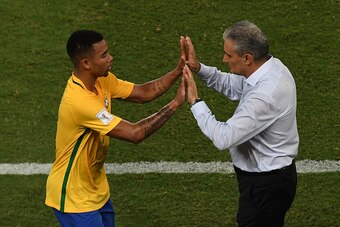 Brazil's Gabriel Jesus shakes hands with Brazilian coach Tite during their Russia 2018 World Cup qualifier football match Bolivia in Natal, Brazil, on October 6, 2016. / AFP / VANDERLEI ALMEIDA        (Photo credit should read VANDERLEI ALMEIDA/AFP/Getty 