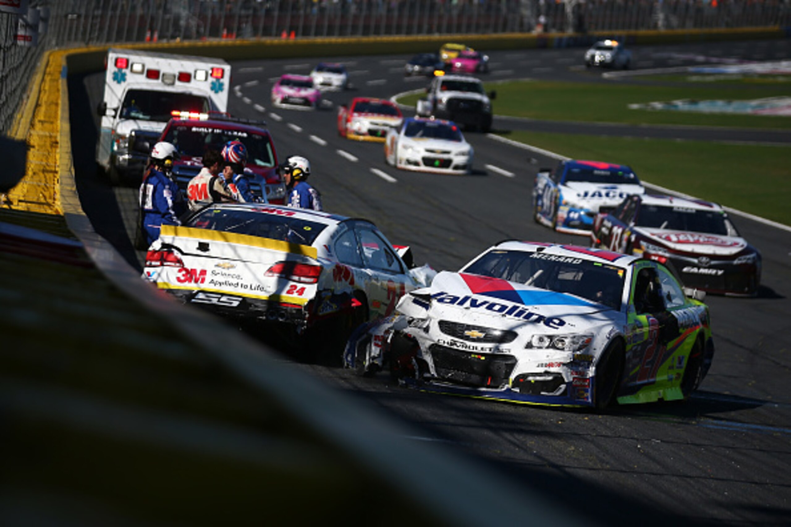 CHARLOTTE, NC - OCTOBER 09:  Chase Elliott, driver of the #24 3M Chevrolet, and Paul Menard, driver of the #27 Valvoline/Menards Chevrolet, spin during the NASCAR Sprint Cup Series Bank of America 500 at Charlotte Motor Speedway on October 9, 2016 in Char